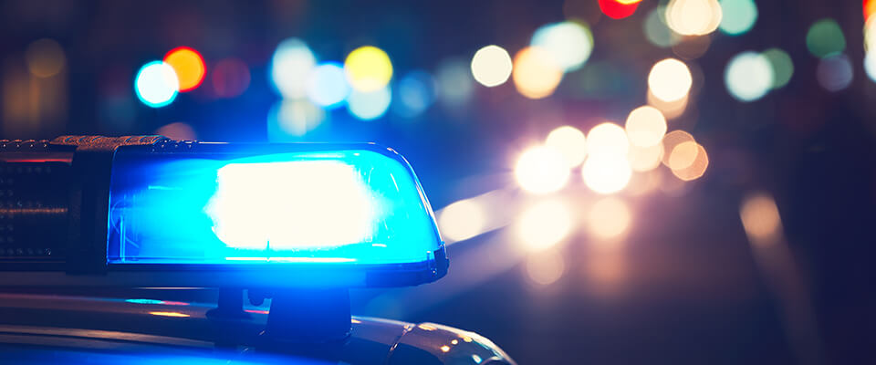 Police car on road at night