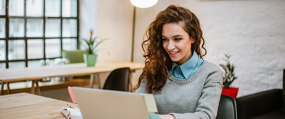Young business woman with a laptop